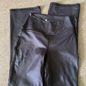 Black leather crossover flare leggings
